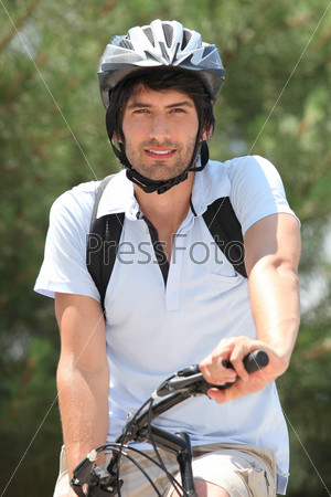 25 years old man doing mountain bike