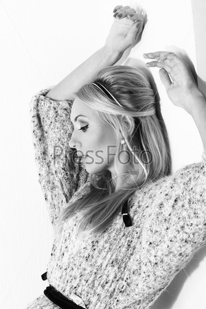 A black and white photo with a beautiful young woman over white background