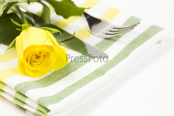 Fresh yellow rose, fork and flower. Healthy food concept