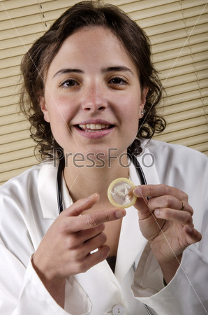medical staff member holding a condom