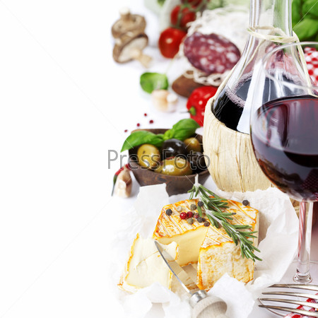 Italian food  (cheese, salami, tomatoe, garlic, pepper, mushroom, olives, olive oil, basil)  and wine over white