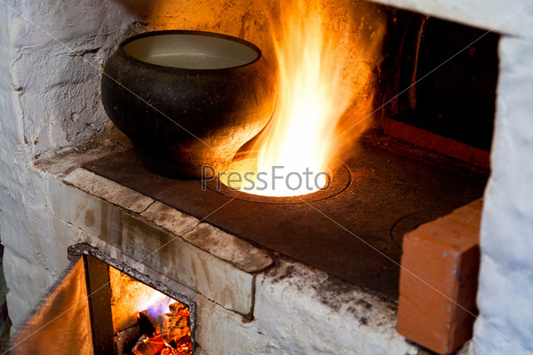 Russian stove and old cast-iron pot