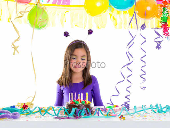 asian child kid girl in birthday party hungry tongue gesture and chocolate cake