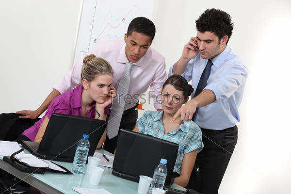 Young people working in an office, stock photo