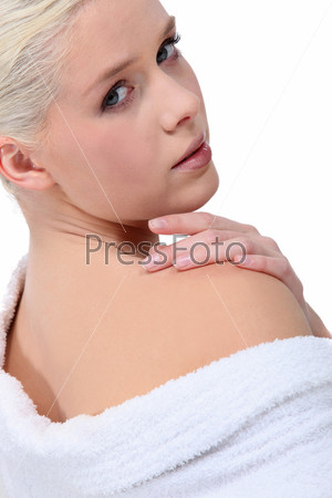 Closeup of a young woman in a white toweling robe