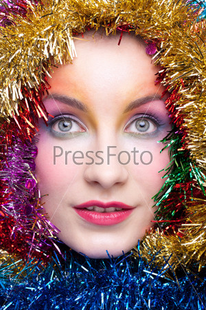 Christmas masquerade portrait of young woman with tinsel