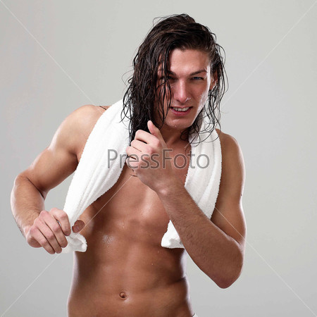 Young sexy man with towel, stock photo