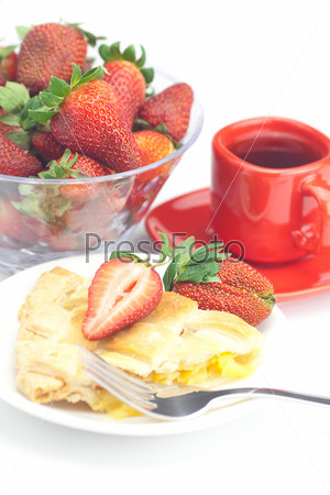 piece of apple pie, fork,cup of tea and strawberries isolated on white