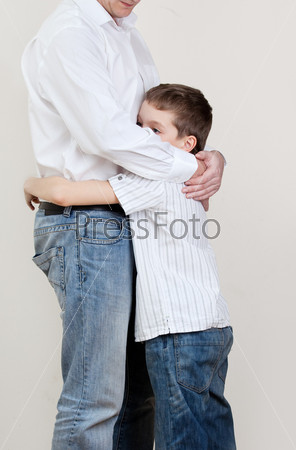 Father comforts a sad child