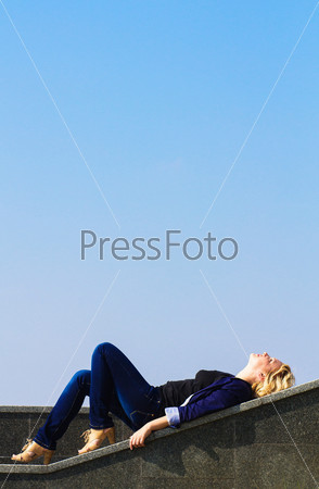 Girl looks at the sky, stock photo