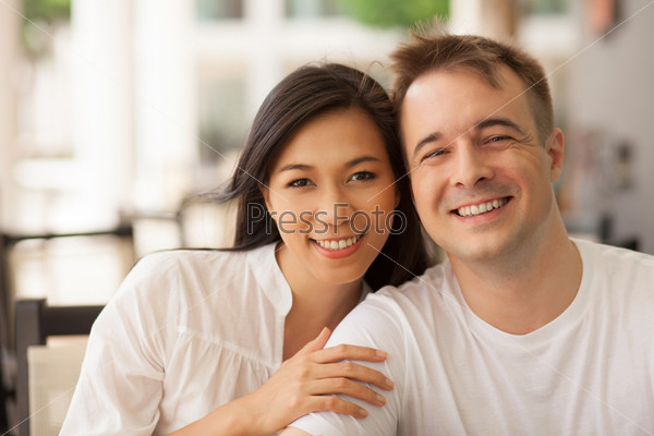 Portrait of beautiful young couple looking at camera