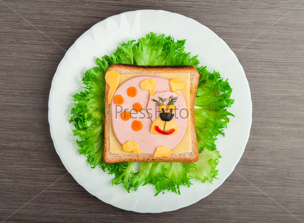 design food. Creative sandwich for a child with a picture little  puppy, doggy