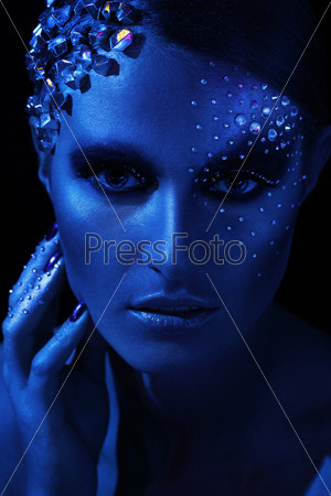 Blue portrait of beautiful woman with artistic make-up
