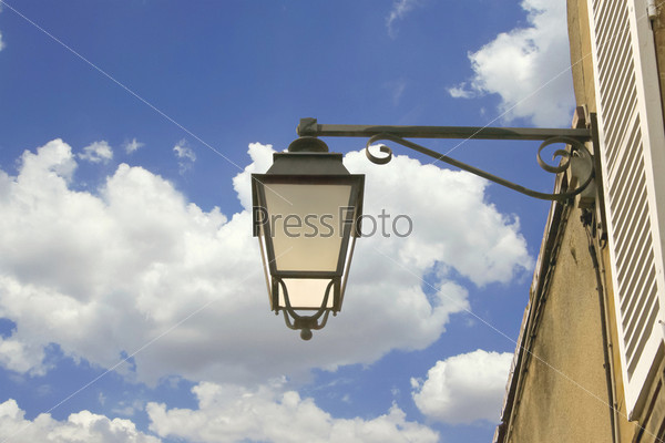 Lantern on the facade of old French house, stock photo