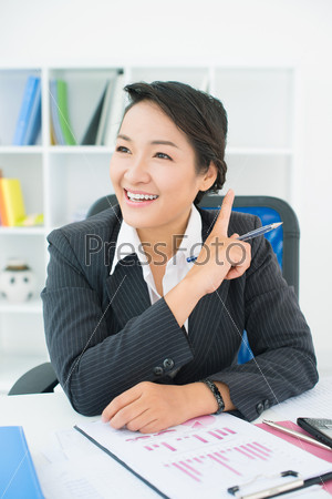 Vertical image of an office lady having a good business idea