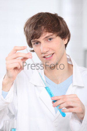 A young man with testing tube, stock photo
