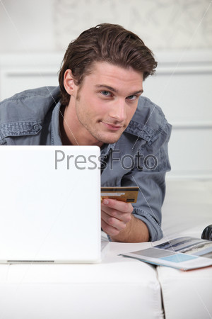 Young man making purchases online
