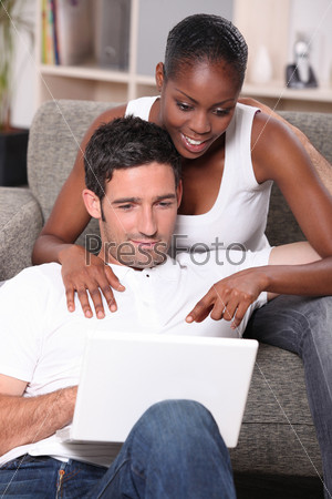 mixed couple surfing the net