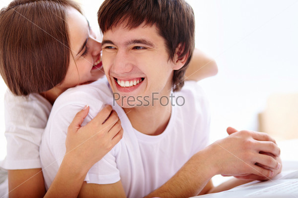 Portrait of happy young couple laughing