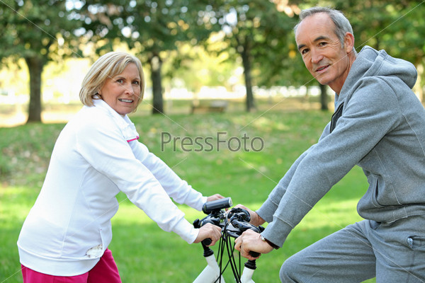 Middle-aged couple on bike ride