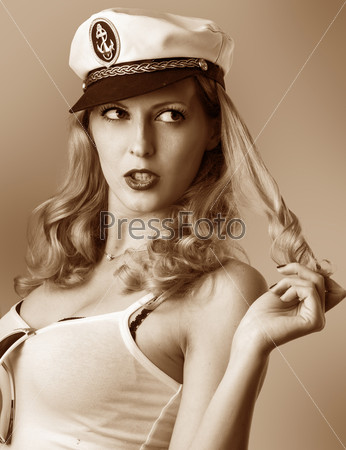 Pin up girl. Beautiful woman in captain cap. Retro style