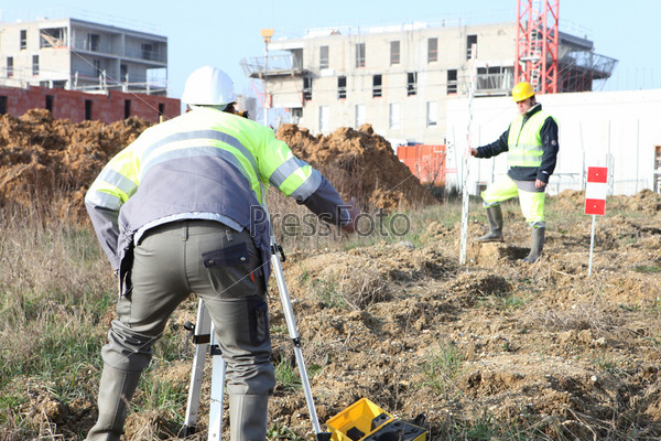Surveyors working on a construction site