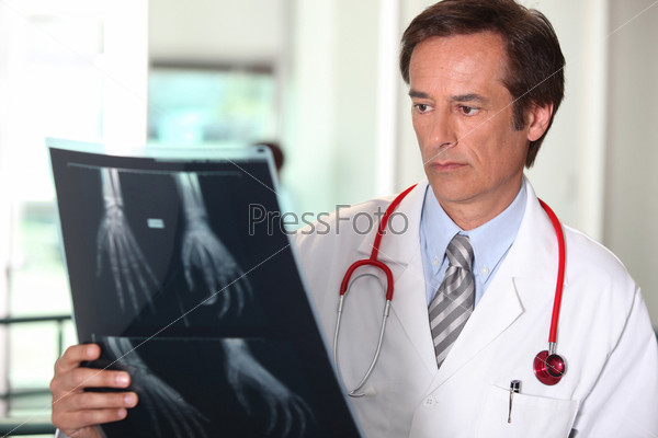 Doctor looking at X-ray