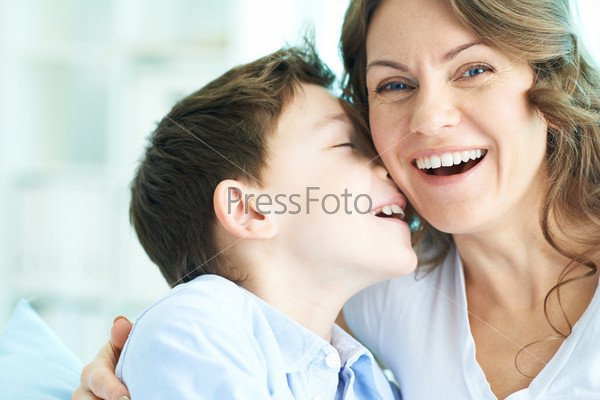 Family Of Ecstatic Mother And Son Laughing