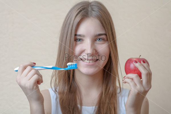 Portrait Of A Blond Woman Brushing Her Teeth