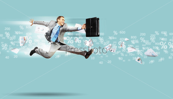Image of a businessman jumping high against financial background, stock photo