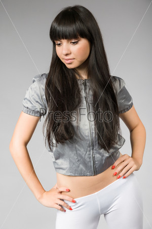 young woman with black hair and white leggings