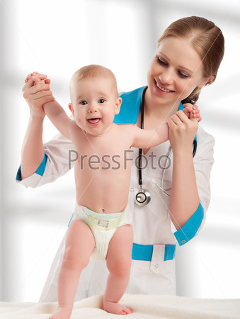 Pediatrician woman doctor holding in his arms baby