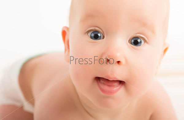 Face of a beautiful happy baby with blue eyes, stock photo