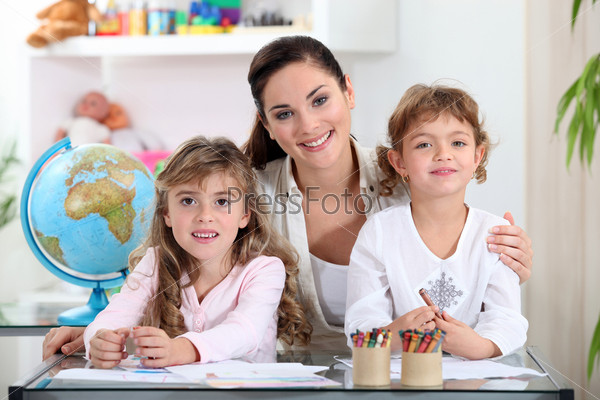 Woman with young children learning about the world