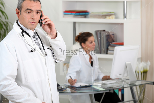 Two medical workers in clinic reception