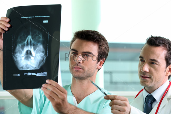 Doctor and nurse watching a radiography