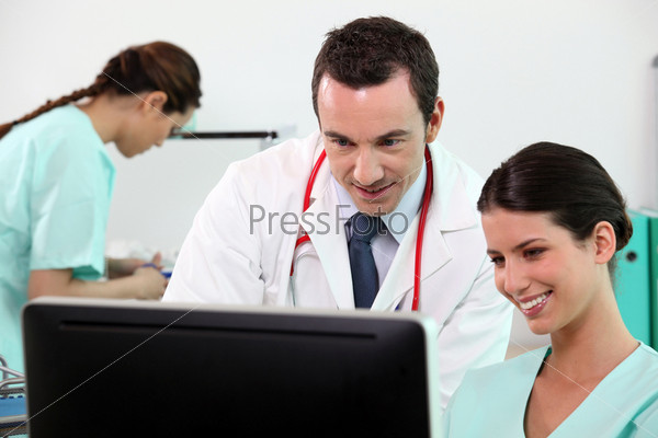 Doctor and nurse at a computer