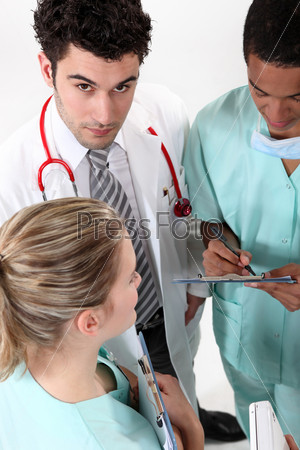 Three hospital staff members having discussion