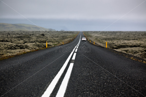 Highway N1 through Iceland landscape at foggy day. Filtered image