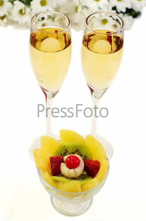 Pineapple, Kiwi, strawberry, and two glasses of champagne