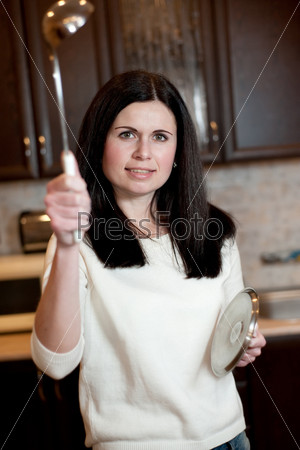 The angry housewife protects kitchen