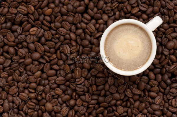 iced coffee with ice-cream topping on coffee beans background