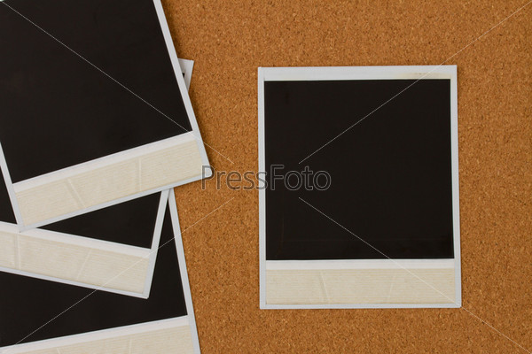 Pile of instant photo on cork background, stock photo