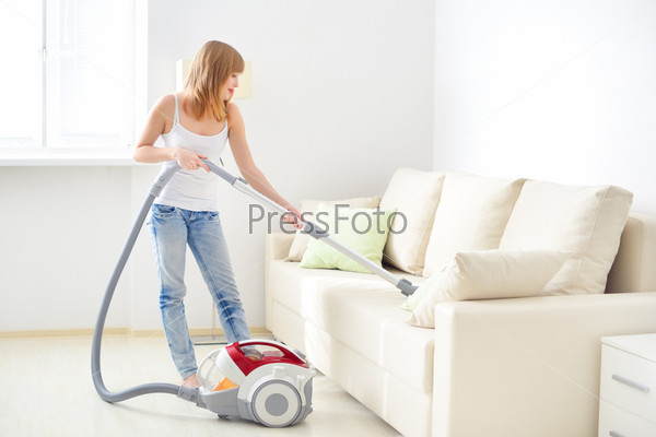 girl cleaning sofa