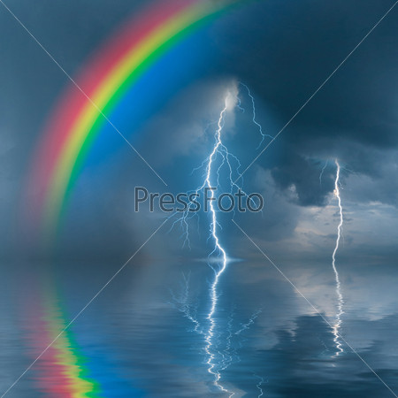 Colorful rainbow over water, thunderstorm with rain and lightning on background