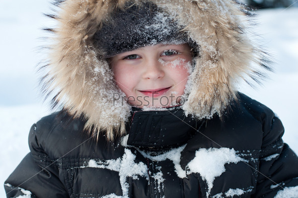 Boy with snow on her face