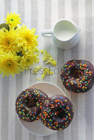 Donuts and milk on a table