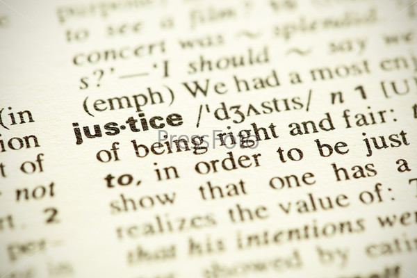 Dictionary definition of the word Justice in English. Vignetting effect.