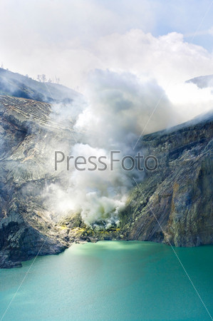 Sulphatic lake in a crater of volcano Ijen.