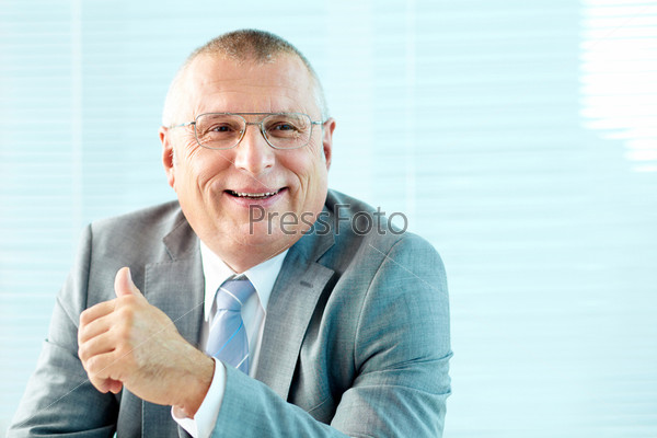 Portrait of elderly businessman in suit and eyeglasses